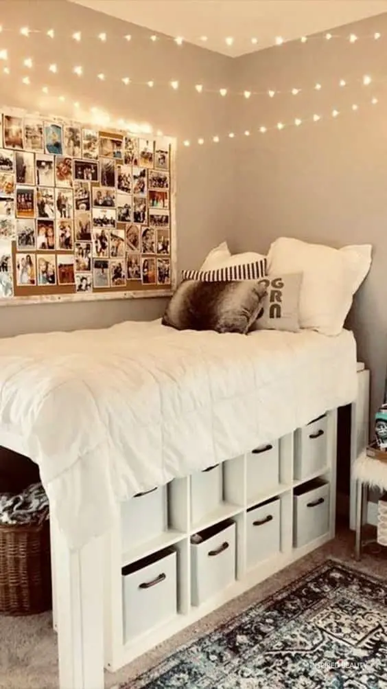 a high bed bedroom with pinboards as the decor