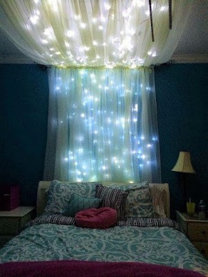 a fairy themed bedroom with lights
