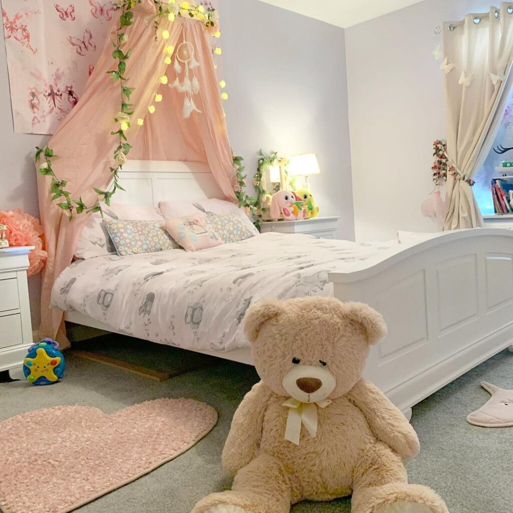 a little girl's' bedroom with soft toys