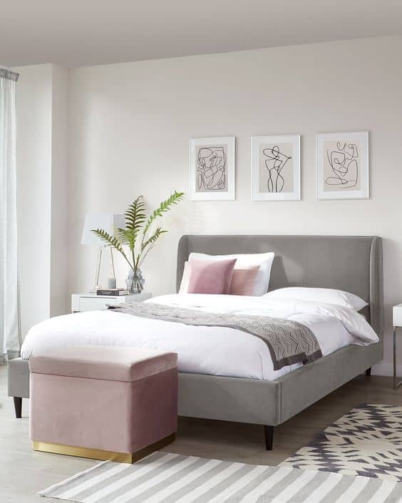 a light grey bedroom with shots of baby pink