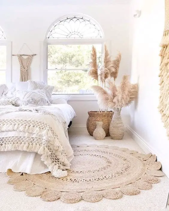white boho bedroom with earthen colored decor