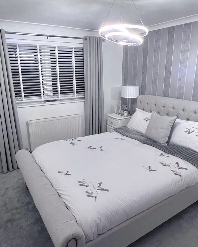 a small grey and white bedroom for teenagers and adults