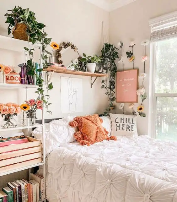 White girl bedroom with plants and books
