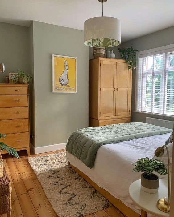 green bedroom with wood accessories