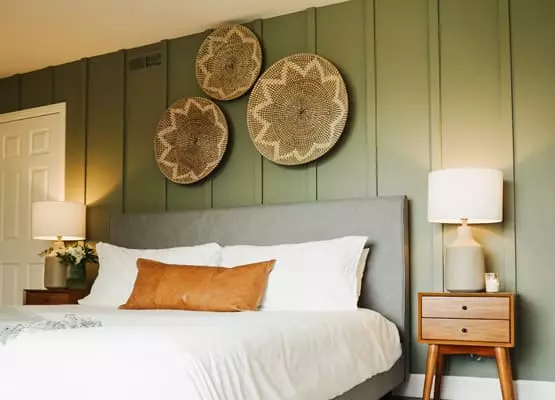 bedroom with sage green wall panels