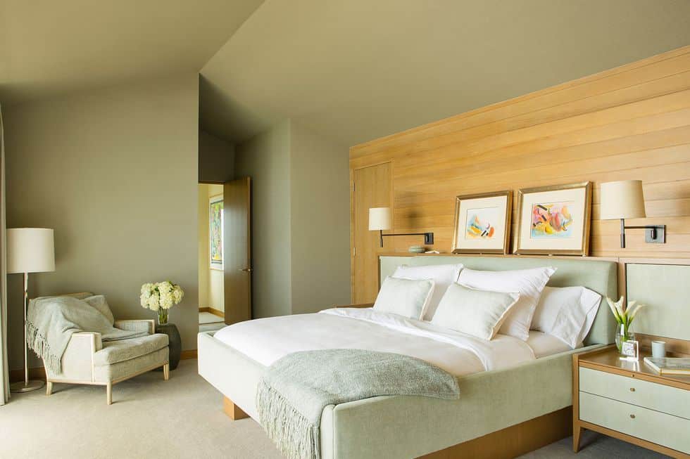 big sage green bedroom with wooden wall panels