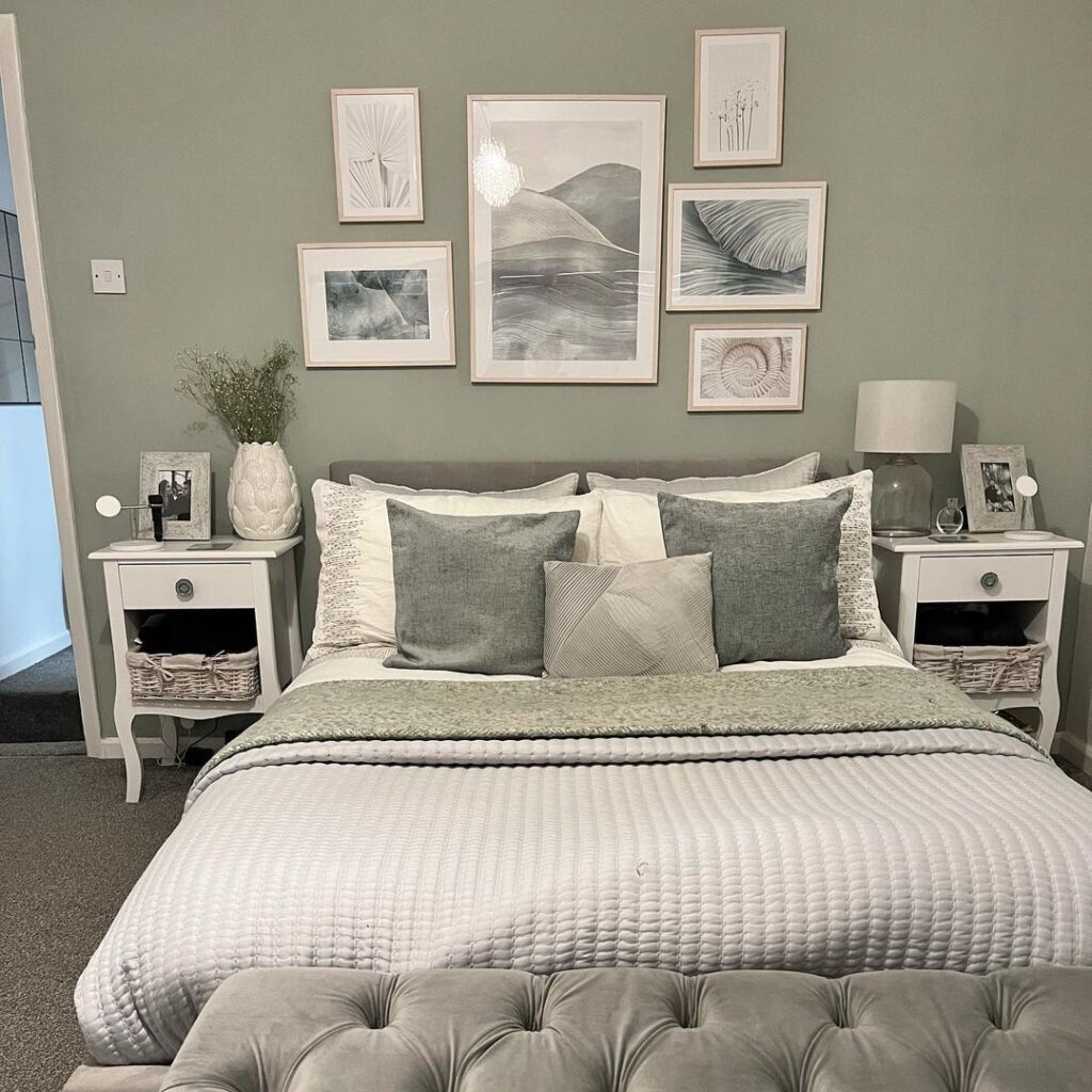 sage green and grey bedroom with a gallery wall