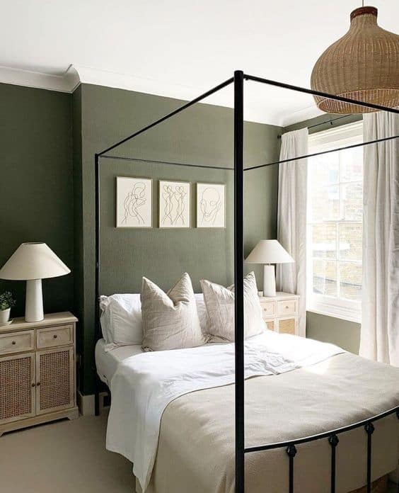sage green bedroom with canopy bed