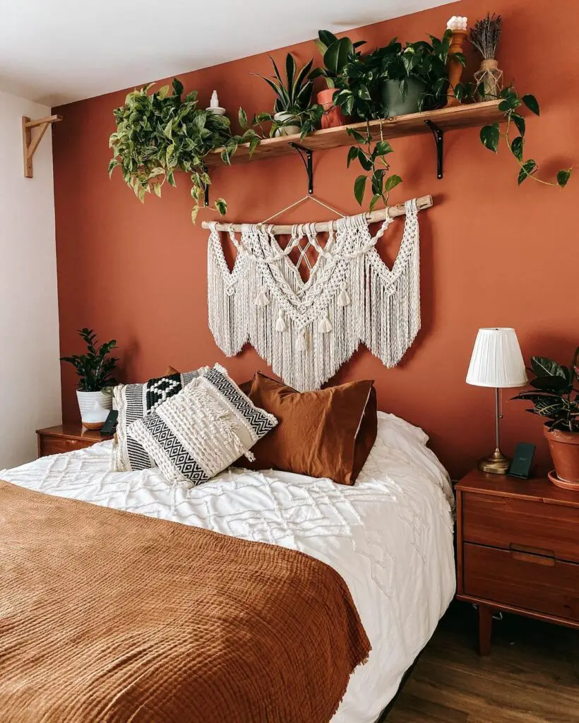 terracotta bedroom with macrame wall hanging