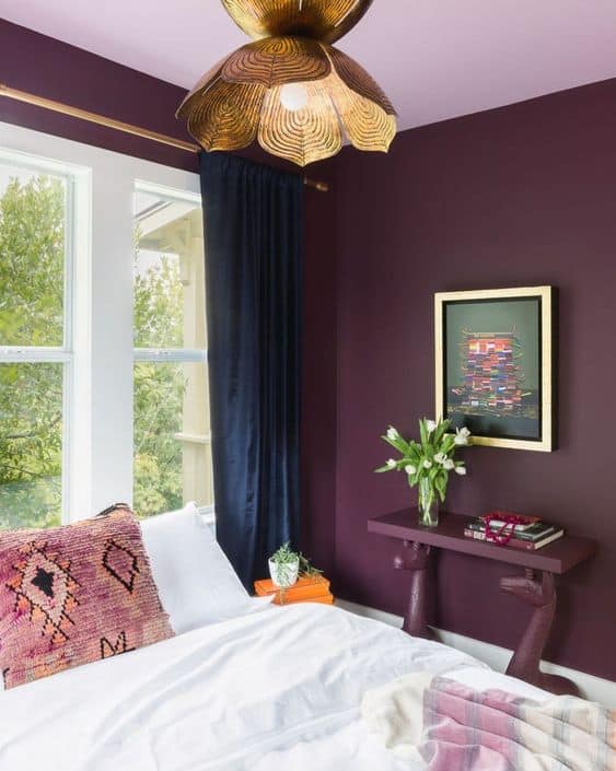 light purple and aubergine bedroom with golden accent