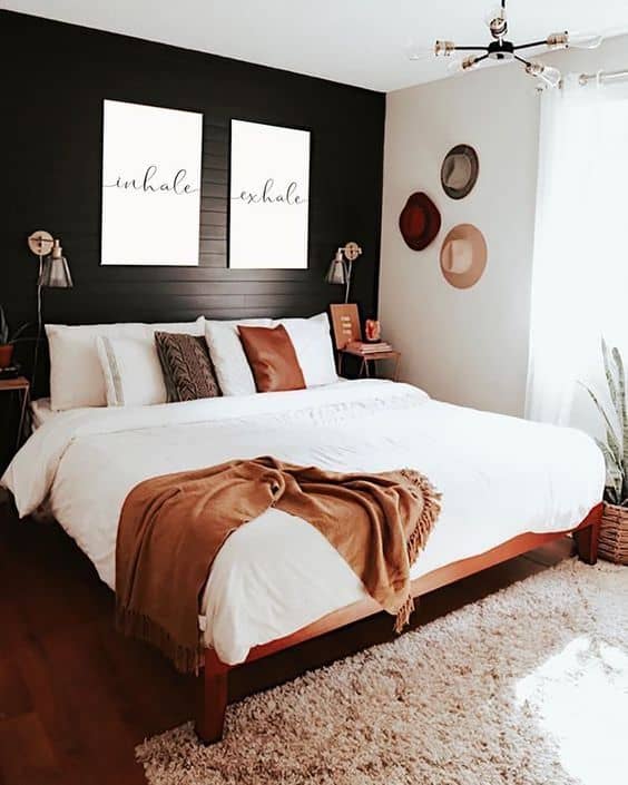 black and white bedroom with brown accents