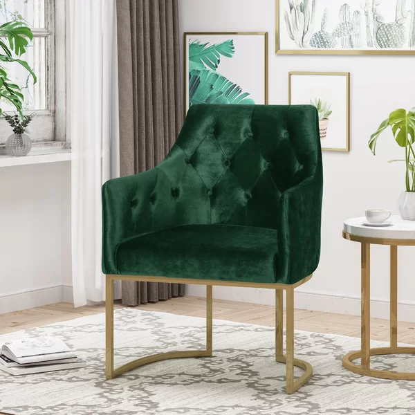 green tufted velvet armchair