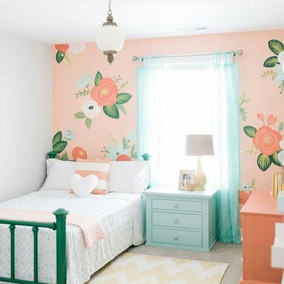 girl bedroom with floral wall 