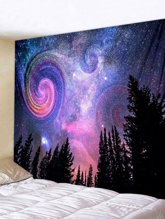 a galaxy tapestry in the bedroom