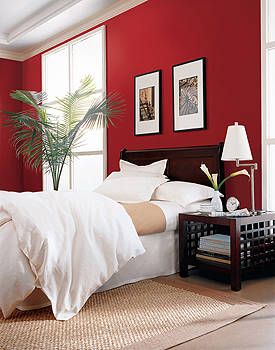 red bedroom with white bedding