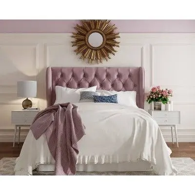 white bedroom with mauve headboard