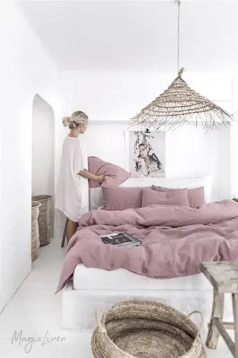 white bedroom with mauve bedding