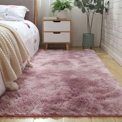 mauve area rug in bedroom