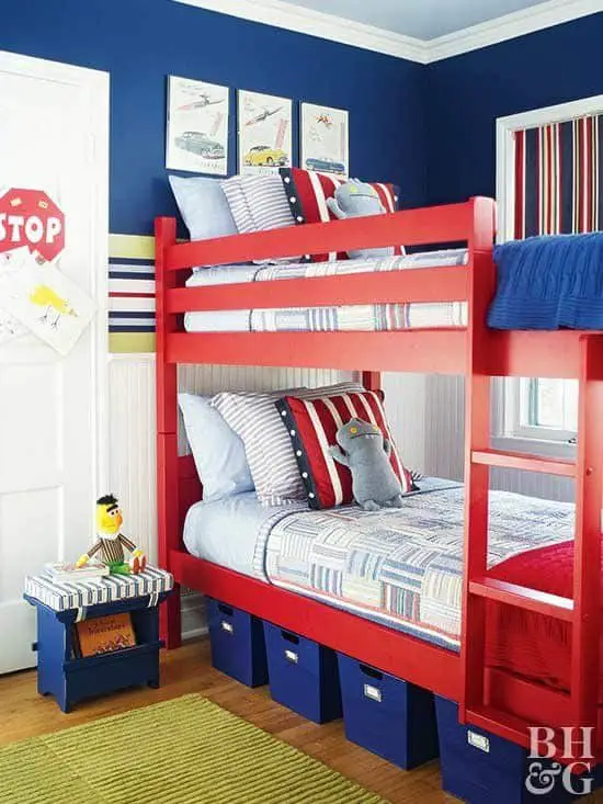 blue and white bedroom with red bunk bed