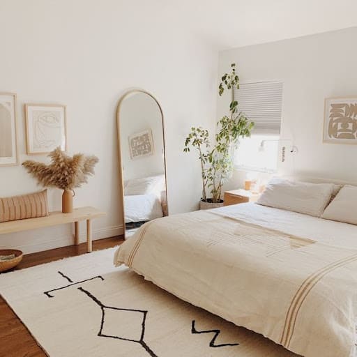 beige bedroom with mirrors