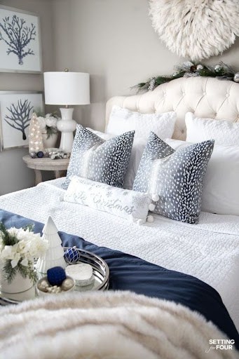 white bedroom with blue bedding
