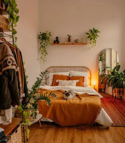 orange and beige bedroom with plants
