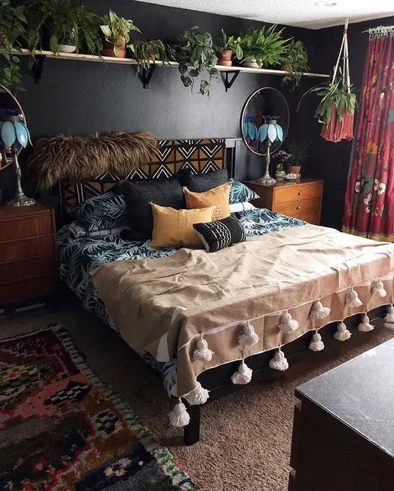 black accent wall bedroom with plants