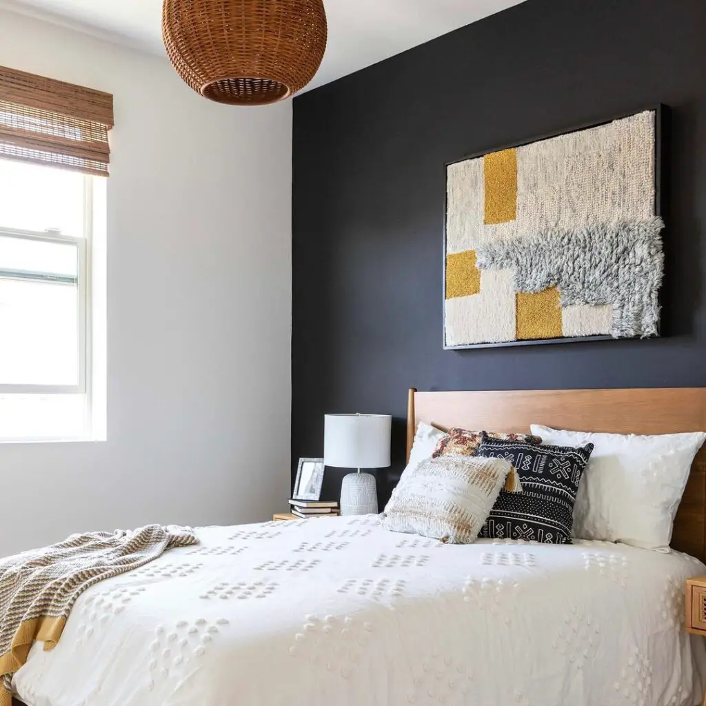 black and white bedroom with mustard accents