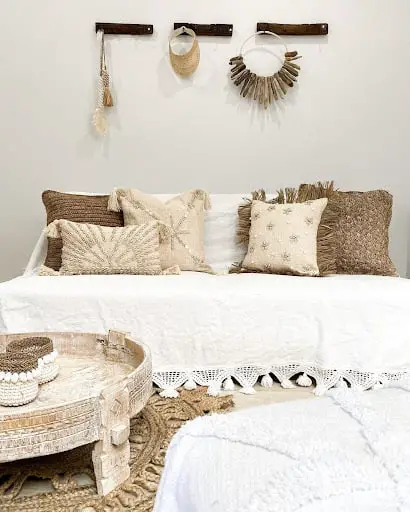 pillows in bedroom with rafia fabric