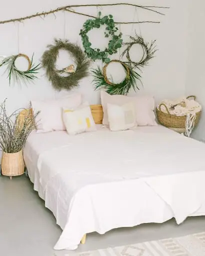 wreath decor in a white bedroom