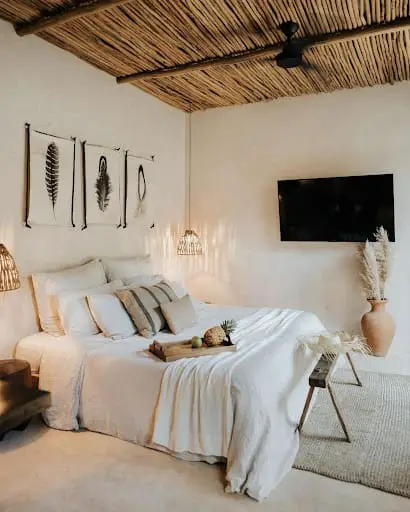 earthy bedroom decor with wooden ceiling