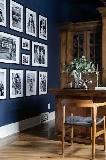 navy blue accent wall with gallery