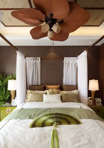 beach themed bedroom with tropical ceiling fans