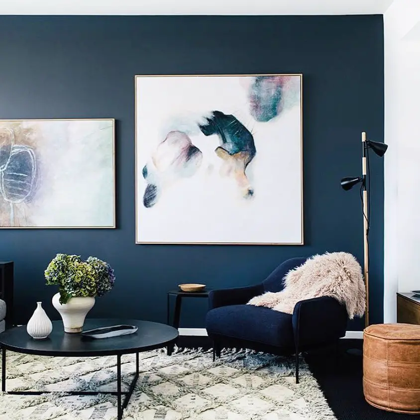 navy blue accent wall with boho accents 