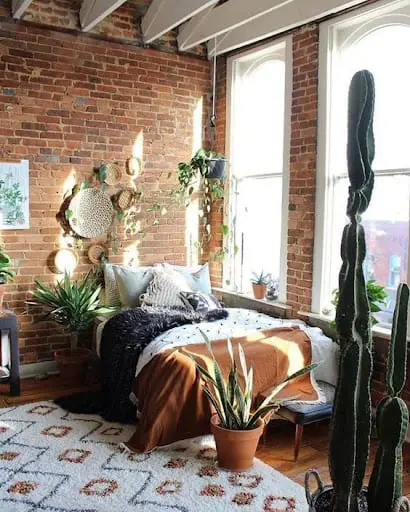 exposed brick wall in a bedroom