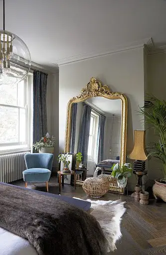 antique mirror in victorian bedroom