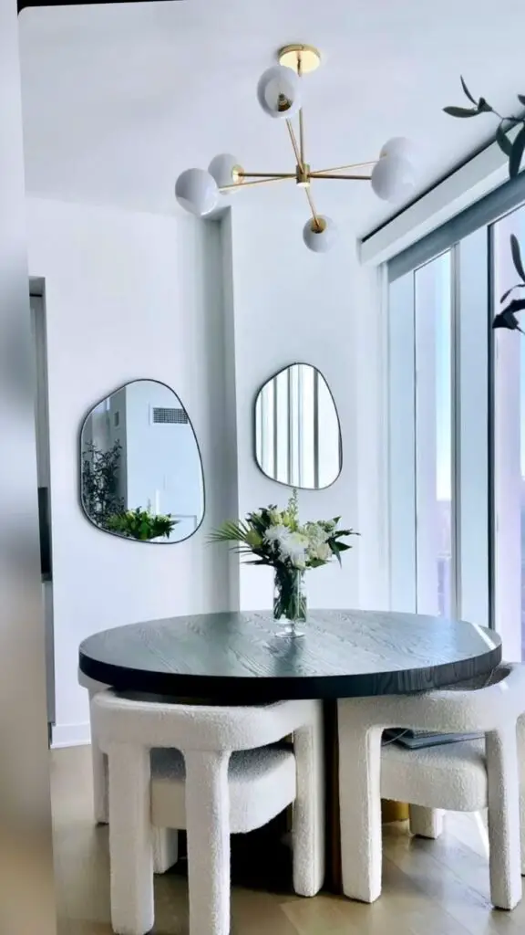 dining room with fluid mirror
