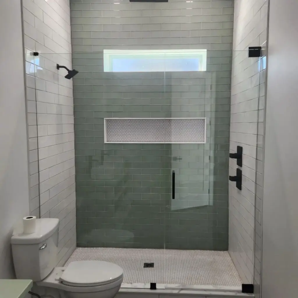 accent wall with tiles in shower room
