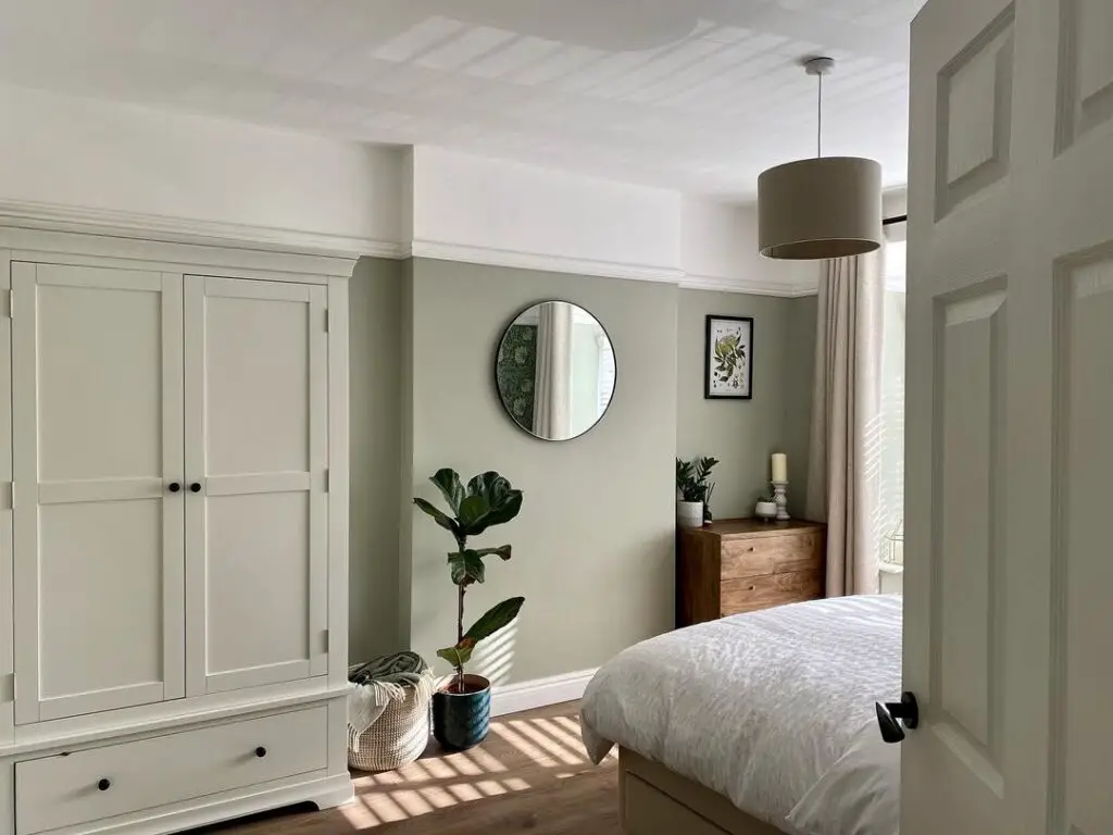 sage green bedroom with sage armoire