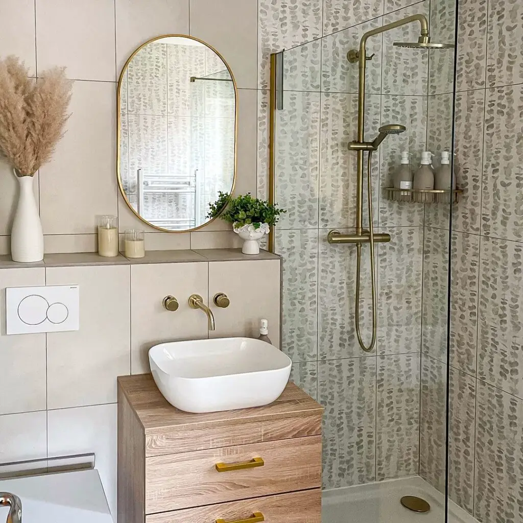 doorless walk-in shower idea with brass fixtures and patterned tiling