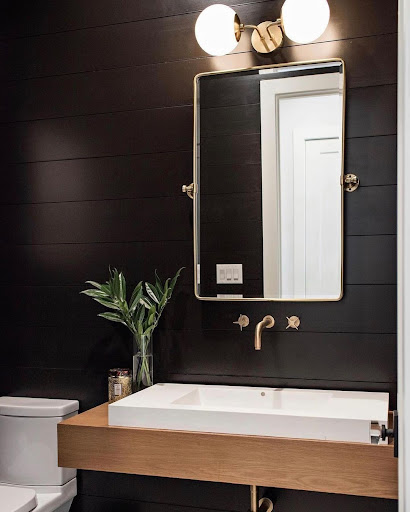 black shiplap wall in the bathroom