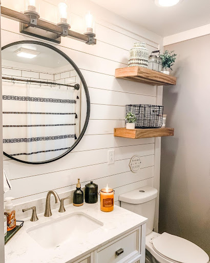 wooden floating shelves in the shiplap bathroom