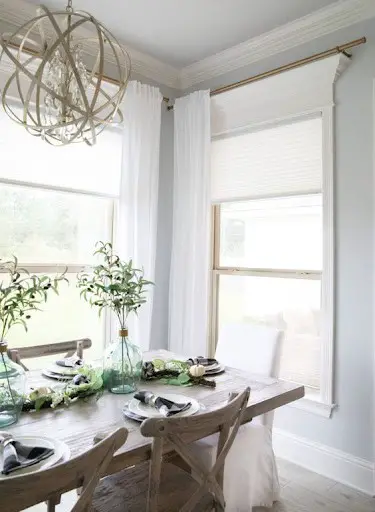 simple white dining room idea with white sheer curtains