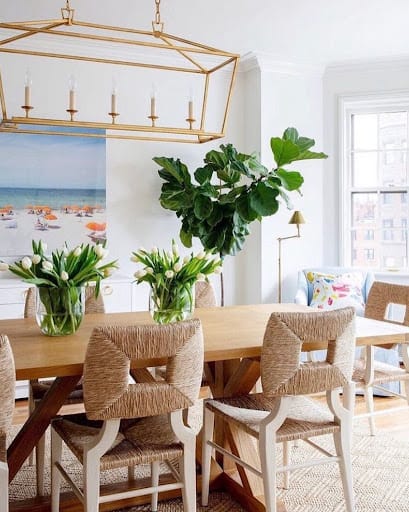 coastal dining room idea with greenery