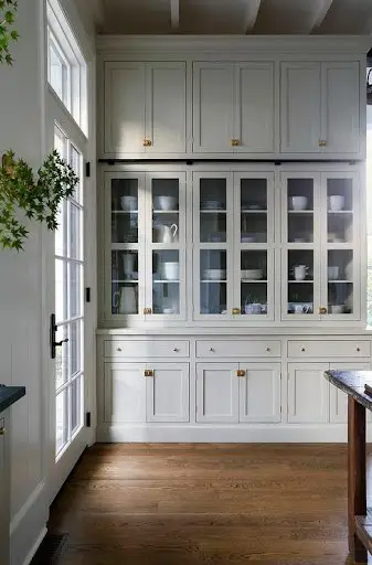 floor to ceiling cabinet design with antique finish