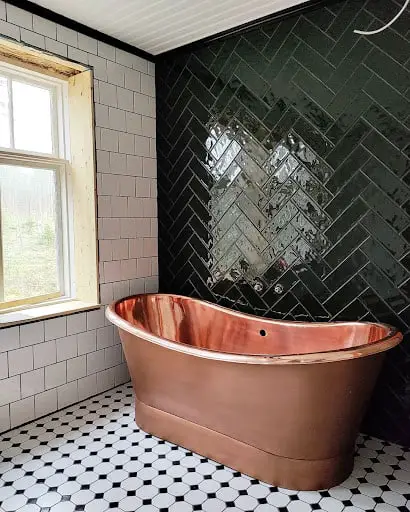 rose gold tub in art deco bathroom