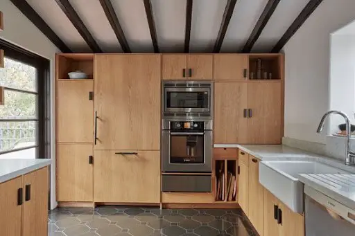mid-century modern kitchen design with floor-to-ceiling cabinets