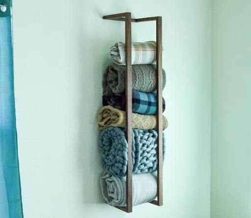 blanket storage idea on a rack