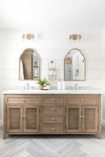 simple coastal bathroom design with shiplap and cabinets