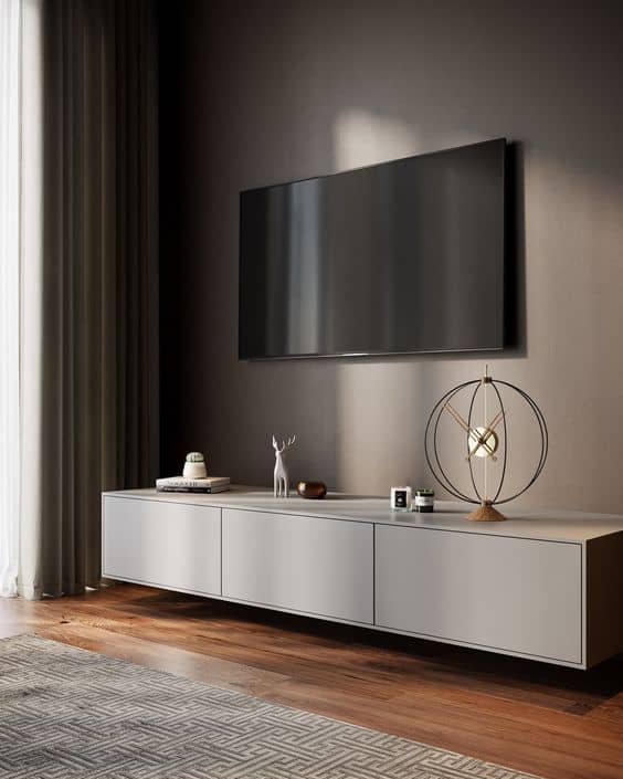 modern tv console decor with clock and sculpture